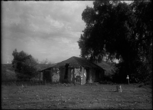 Brick + Straw house, woman