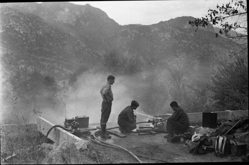 Wildland Fires, flume fires. Pumping water from flume — Calisphere