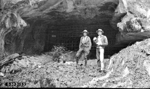 cave entrance. Ranger Lawrence Cook on left