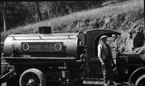 Vehicles and Equipment, Maintenance Activities, road oiler at work. Individual Unidentified