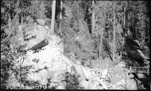 Construction, approach through rock to bridge (East Fork) (stations 66 and 80) from Atwell station