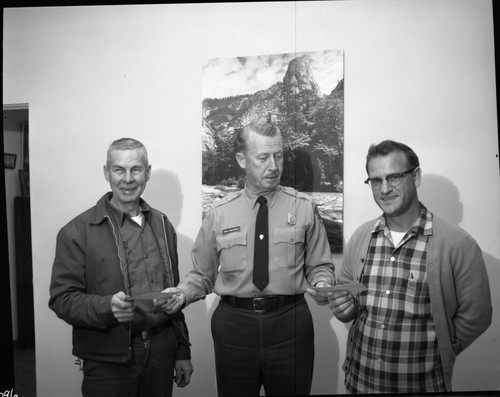 Cash awards to Roland Cowle (left), and William Botts (right) by Superintendent McLaughlin. Dedications and Ceremonies, NPS Individuals. Park Superintendents