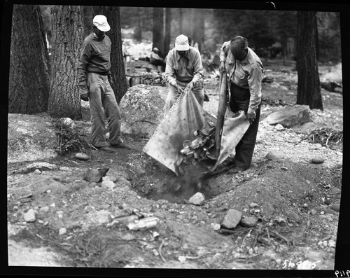 Backcountry cleanup, burying cans. Wirth and Gilbert