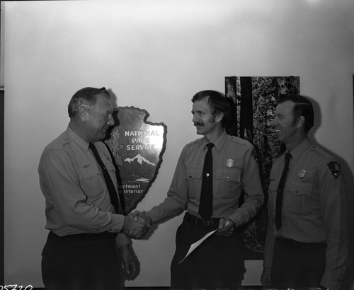 NPS Individuals, Larry Thomas (center) gets award from Chief Park Ranger Bob Smith. Bob Scott on right