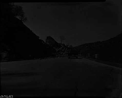 R.A. Grom, Highway 198 below Three Rivers, Floods and Storm Damage, Rock slide on highway. View down canyon at first roadout near Slick Rock. 620304