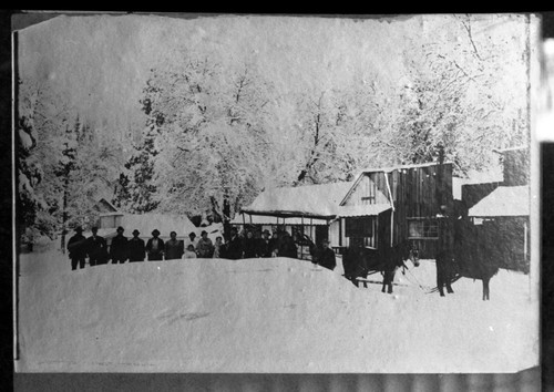 P.E. Stock 050000, Millwood, Logging, In front of post office, winter 1905-06. Remarks: Mail coach on four runners drawn by four horses