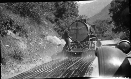 Vehicles and Equipment, Maintenance Activities, road oiler at work. Individual Unidentified