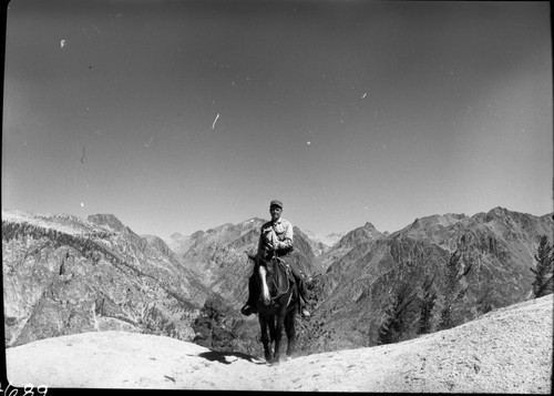 Stock Use, looking north from ridge north of Dougherty Meadow, V. Westley in picture. NPS Individuals