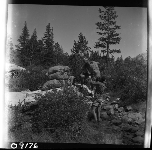 Backcountry cleanup, staking sacked cans