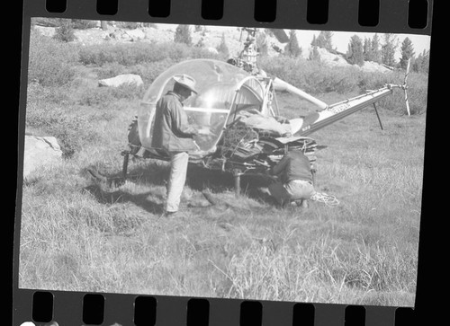 Backcountry cleanup, loading sheet metal on heli-copter