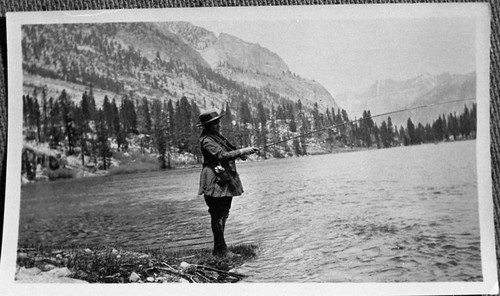 Fishing, Misc. Lakes. Unidentified member of the Knapp party fishing at East Lake. Good period dress photograph