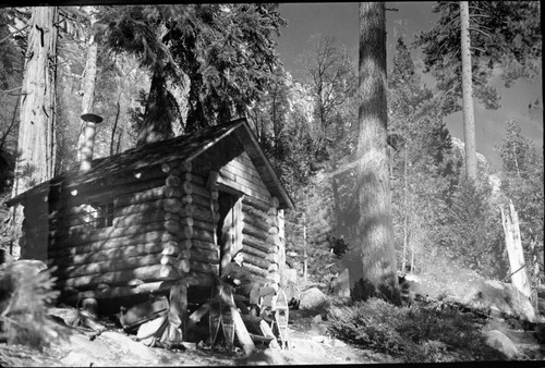 Backcountry Cabins and Structures, Old snow surveyors cabin on Bubbs Creek, burned in forest fire, 1976. Nelson Murdock in cabin door