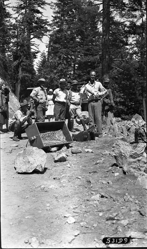 Giant Forest, SNP. Construction, NPS Individuals, NPS Groups, General Foreman Parkes and gun used to shoot line over rock