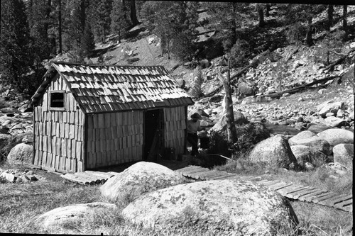 Backcountry Cabins and Structures, Kern Hot Springs, bath house showing new shakes, puncheon walk, rail fence