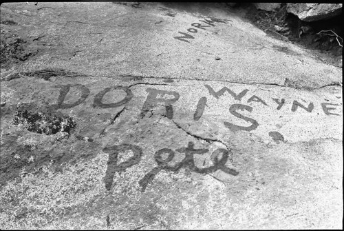 Vandalism, names painted on rock