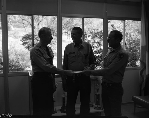 NPS Groups, Middle: Troy Hall, Right: Steve Wright presenting cash to Superintendent McLaughlin (left) for flower fund. Park Superintendents