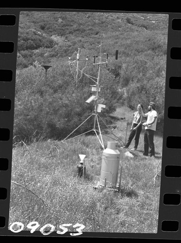 Research Activities, Researcher Larry Norris and visiting English student Jane Whitaker at acid rain station