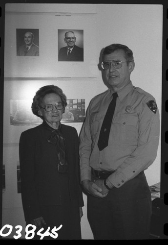 Park Superintendents, NPS Individuals. Irma Buccholz, Secretary to the Superintendent and Supt. John H. Davis posed under photographer of his father, former Supt. John M. Davis. Irma Buccholz was sec