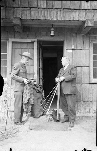 NPS Individuals, Chief Ranger John Wagner and Commissioner Mike Griffith inspecting articles stolen from High Sierra Camp