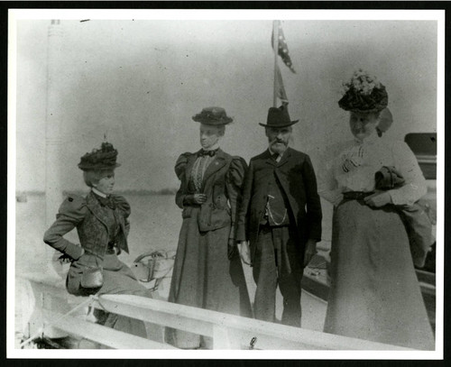Ellen Browning Scripps and others next to boat
