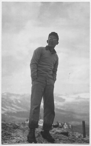 Young man standing on rock