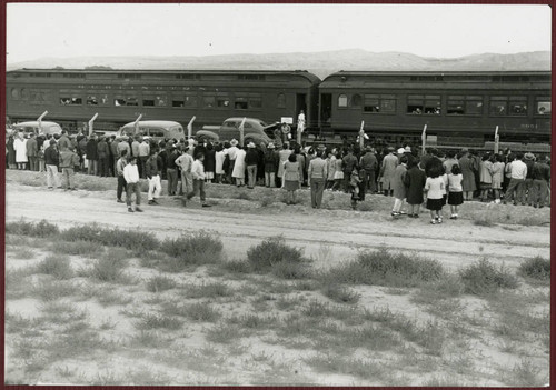 A crowd seeing friends leaving from camp