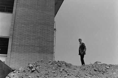 Man stands near building