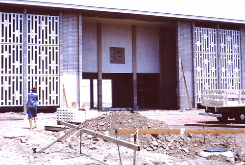 Virginia Atherton walks in front of Scott Hall construction