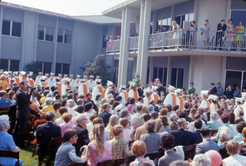 Graduates process into Scott Courtyard