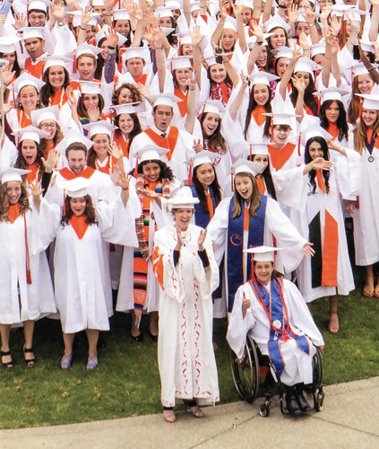 President Trombley cheering with graduates