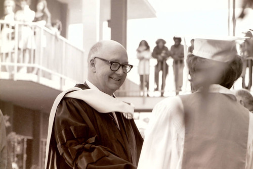 President Atherton congratulates a graduate on commencement