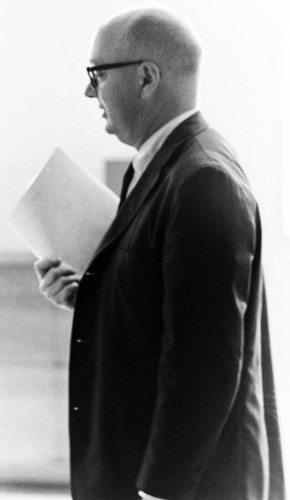 John Atherton holding document in profile