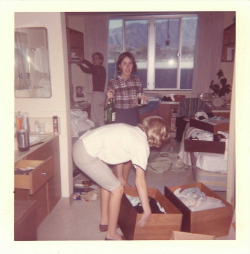 Three students in Sanborn Hall dorm room