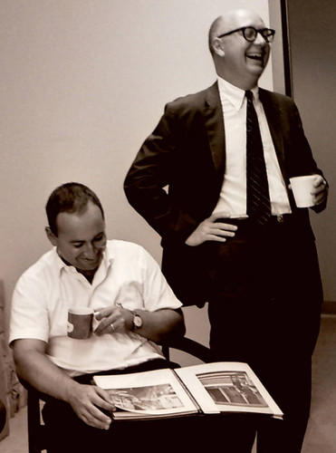 John Atherton holding a beverage and laughing