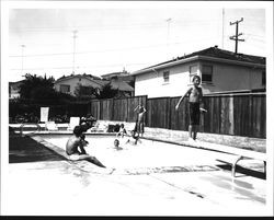 Children playing in a backyard pool, Santa Rosa, California, 1962