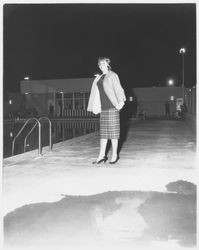 Unidentified Miss California contestant modeling a plaid skirt, sweater and jacket ensemble in the Aqua Varieties fashion show at the Swim Center, Santa Rosa, California, 1959