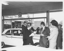 Large group at G.K. Hardt preparing to board buses to San Francisco, Santa Rosa, California, 1960