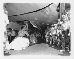 Marie Hindringer, Miss Sonoma County christening an airplane at the Coddingtown Airport, Santa Rosa , California, 1960