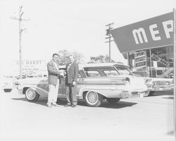 G. K. Hardt and Hugh Codding stand in front of a 1959 Mercury Colony Park station wagon at his G.K. Hardt Lincoln-Mercury dealership, Santa Rosa, California, 1958