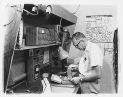 Technician at a workbench in M. L. Bruner Company, Santa Rosa, California, 1964