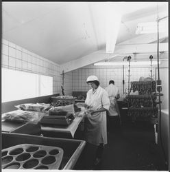 Two workers packing sausages at 865 West Napa Street, Sonoma Sausage Company, Sonoma, California, 1981