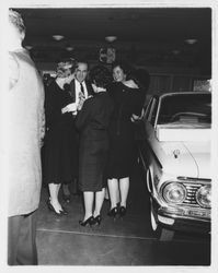 Large group at G.K. Hardt preparing to board buses to San Francisco, Santa Rosa, California, 1960