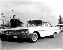 G. K. Hardt with a Mercury automobile, Santa Rosa, California, 1960