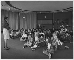 Molly McDermott speaking to a group of children in the Forum Room