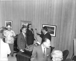 Congressman Don Clausen talking on telephone at grand opening of Summit Savings, Sebastopol, California, September 30, 1967
