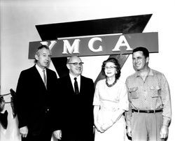 YMCA Secretary Donald Morse and three unidentified people standing in front of a YMCA sign, Santa Rosa, California, 1963