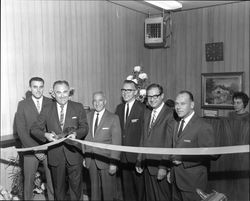 Congressman Don Clausen cutting the ribbon at grand opening of Summit Savings, Sebastopol, California, 1967