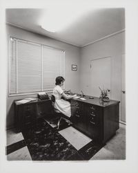 Mikesell Dental Laboratory secretary at her desk, 600 B Street, Santa Rosa, California, 1962