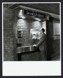 Customer using an Exchange Bank automatic teller machine, Santa Rosa, California, 1980