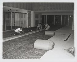 Laying carpet at the Flamingo Hotel, Santa Rosa, California, 1957